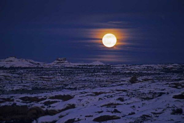 UT, Arches NP Full moon rising over snowy scenic
